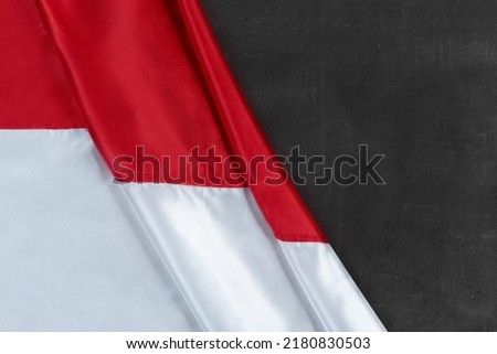 Red and white flag with a black background. Indonesian independence day