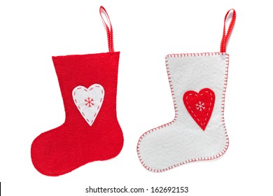 Red And White Handmade Christmas Stockings Isolated On A White Background.