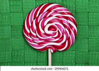 A Red And White Large Spiral Lollipop