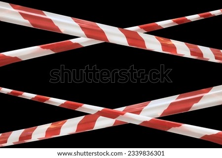 Red and white lines of barrier cross tape prohibit passage, tape on black isolate. Barrier that prohibits traffic. Danger unsafe area warning tape do not enter. Concept no entry. Copy space