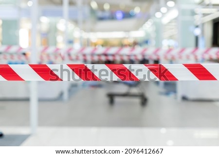 Red and White Lines of barrier tape. Striped, red and white tape that forbids passage. Red White warning tape pole fencing is protects for No entry.