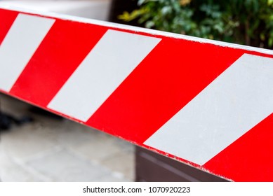 Red and white non-entry barrier. Restricted area.