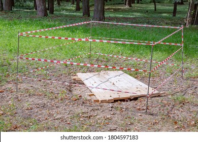 Red And White Police Tape In The City Park. Sinkhole Warning