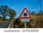 red and white road warning sign of Iberian Lynx, Lynx pardinus, a Wild Cat Species Endemic to the Iberian Peninsula in Spain and Portugal, highly threatened and close to extinction.