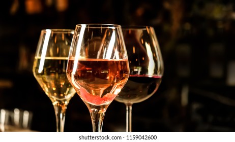 Red, White And Rose Wine Glasses Up