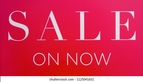 Red And White Sale On Now Sign.