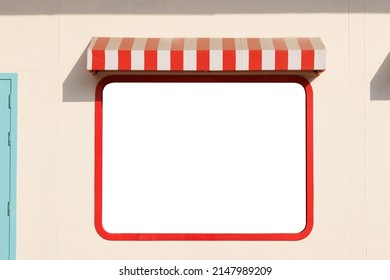 red and white striped awning over white mockup window in afternoon time. roof canvas with white mock up advertisement.