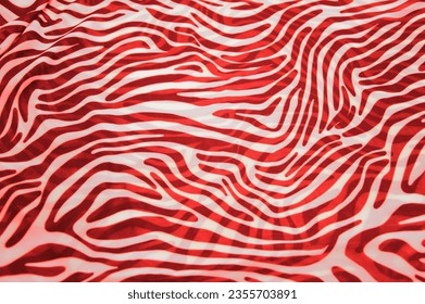 Red and white stripes, bends - a pattern on the fabric as a background texture. Animal abstract background.