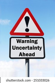 A Red And White Triangular Road Sign With A Warning About Uncertainty Ahead Concept Against A Partly Cloudy Sky.