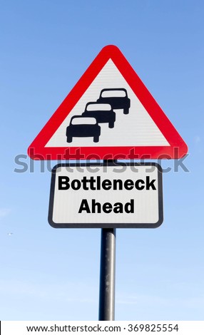 Red and white triangular road sign with a Bottleneck Ahead concept against a partly cloudy sky background