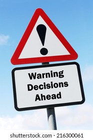 Red and white triangular warning road sign with a warning of decisions ahead  concept against a partly cloudy sky background