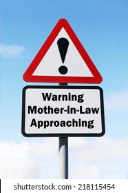 Red And White Triangular Warning Road Sign With A Warning Of Mother In Law Approaching Concept Against A Partly Cloudy Sky Background