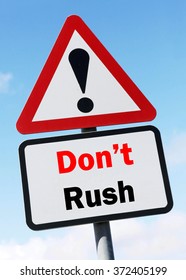 Red and White triangular warning road sign with a Don't Rush concept against a partly cloudy sky background.