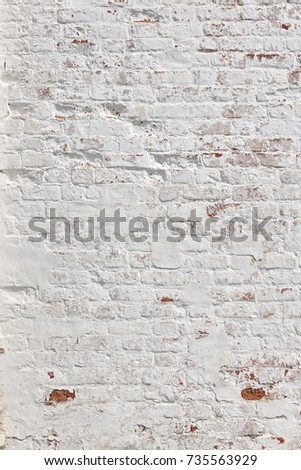 Red White Wall Vertical  Background. Old Grungy Brick Wall With White Uneven Stucco. Vintage Wall With Peeled Plaster.
