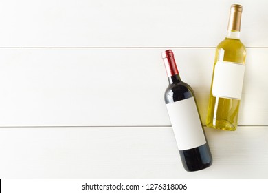 Red And White Wine Bottle On White Wooden Table Flat Lay From Above With Copy Space