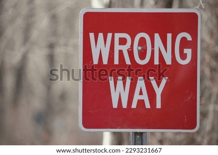 red and white wrong way sign 