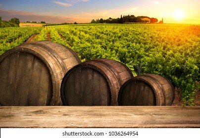 Red Wine With Barrel On Vineyard In Green Tuscany, Italy