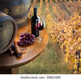Red Wine With Barrel On Vineyard