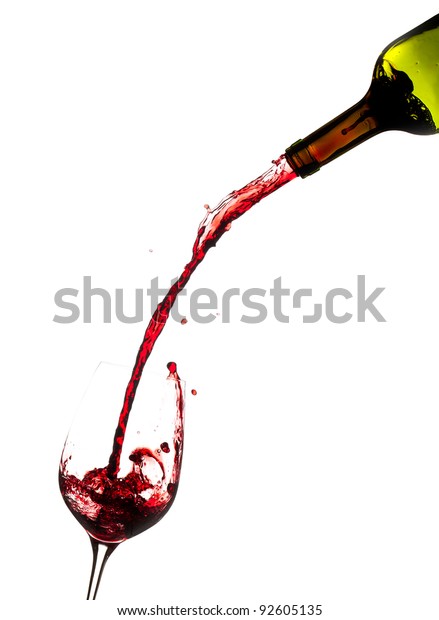 Stock photo of red wine being poured into a wine glass