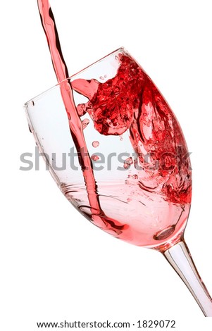 Red wine being poured into a wine glass