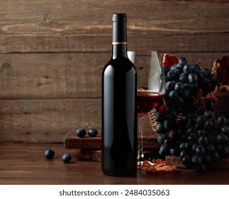 Red wine and blue grapes. Wine and grapes in a vintage setting on an old wooden table. - Powered by Shutterstock