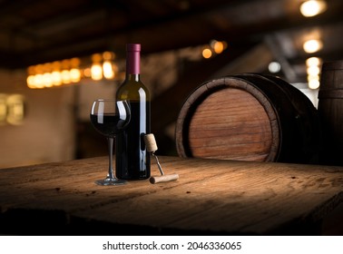 red wine bottle and wine glass on wodden barrel - Powered by Shutterstock