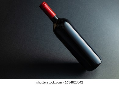 Red Wine Bottle Mockup Without Label On Black Background.