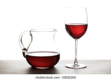 Red Wine In A Wine Carafe And A Wine Glass Over White Background