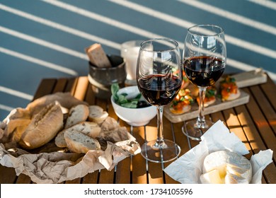 Red wine with charcuterie assortment on the table