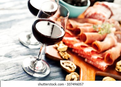 Red Wine With Charcuterie Assortment On The Background