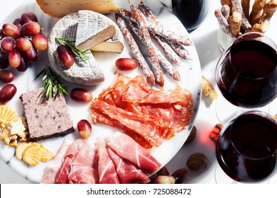 Red Wine And Charcuterie Assortment On The Board