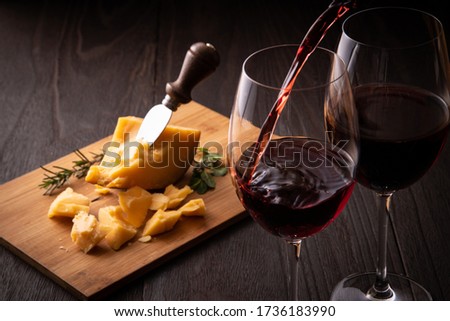 Red wine and cheese on the table