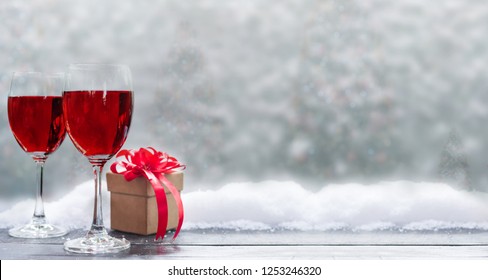 Red Wine For Christmas And Happy New Year Party. Winter Season Holiday With Snow And Decoration.