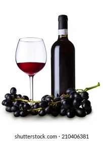 Red wine in the glass and the bottle with fresh grapes. Isolated on white. 
