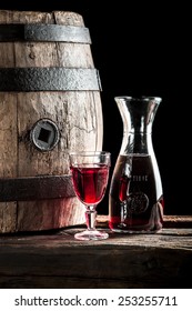 Red Wine In Glass And Carafe In The Old Winery