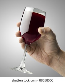 Red Wine Glass Holding By A Male Hand