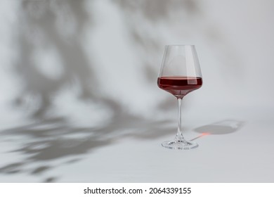 Red wine in a glass isolated on white background, copy space