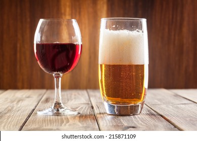Red wine glass and glass of light beer 