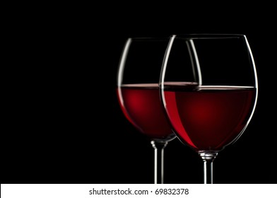 Red Wine In Glass On Black Background Close Up