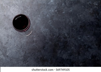 Red Wine Glass On Stone Background. Top View With Copy Space