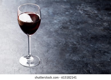 Red Wine Glass On Stone Table. With Copy Space