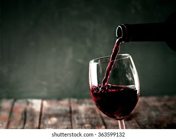 Red wine. Glass of wine. Pouring red wine.