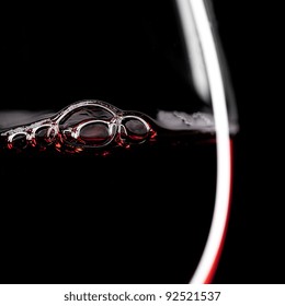 Red Wine Glass Silhouette On Black Background With Bubbles