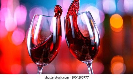 Red Wine Glasses Hitting Together in a Bar, Cheers Concept. - Shutterstock ID 1904293777
