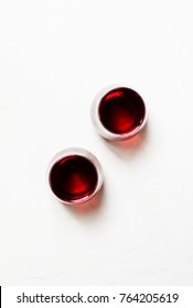 Red Wine In Glasses On A White Background, Top View