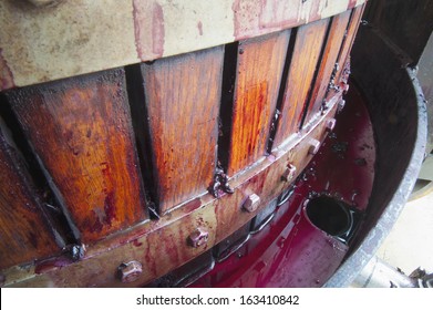 Red Wine Grapes Being Crushed In Basket Press In The Barossa Valley South Australia