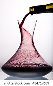 Red Wine Pouring In Decanter.