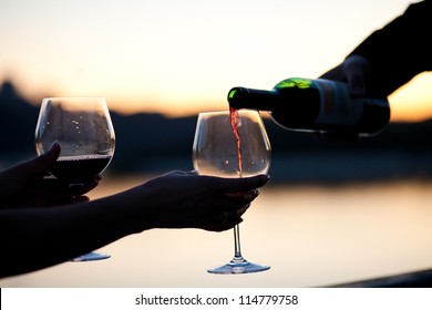 Red Wine Pouring Into Glass