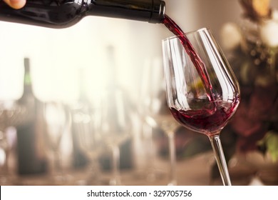 Red Wine Pouring In A Restaurant