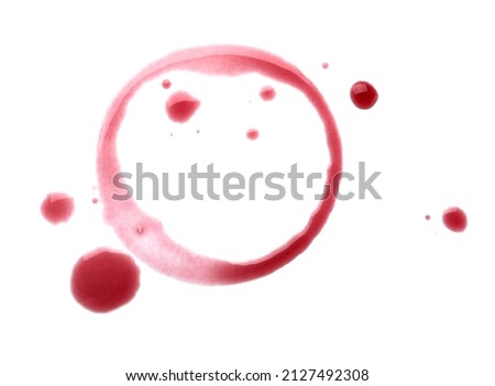 Red wine ring and drops on white background, top view